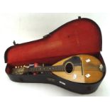 A vintage wooden banjo by S S Stewart, of New York, in original carry case,