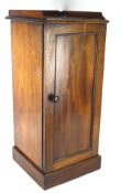 A 19th century mahogany pot cupboard, a single panel hinged door to the front,