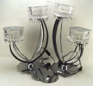 A pair of contemporary decorative lamps with black and metal supports and diamante details,