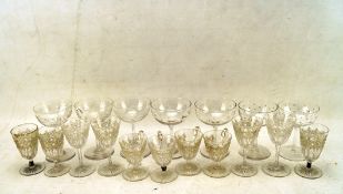 A selection of assorted glass drinking glasses, of varying sizes and designs,