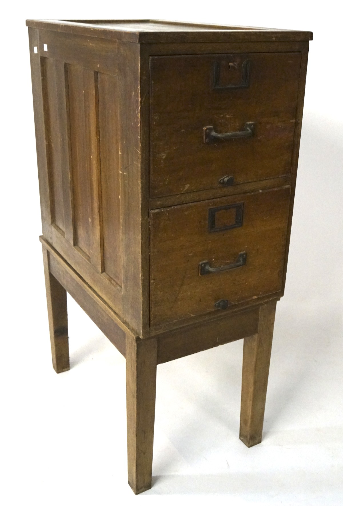 An early 20th century wooden filing cabinet on stand, comprrising two drawers,