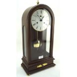 A 20th century German Angelus mahogany cased mantle clock with Roman numerals to the enamel face