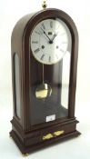 A 20th century German Angelus mahogany cased mantle clock with Roman numerals to the enamel face