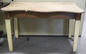 An early 20th century pine kitchen table base, with a later shaped top,