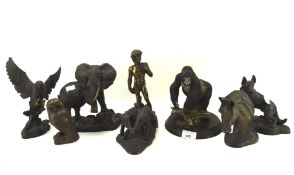 A group of resin models of animals including an eagle, gorilla, elephants,