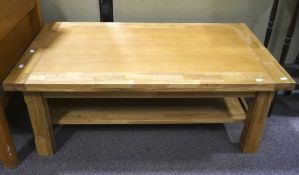 A contemporary oak coffee table,