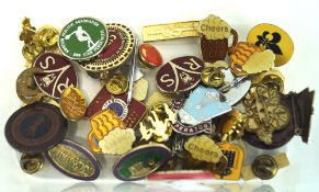 A selection of vintage badges, including some with enamel decoration,