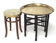 An Eastern table top brass tray with folding stand and a brentwood stool converted to a side table