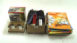 A large collection of model railway related models and accessories including trains, carriages,