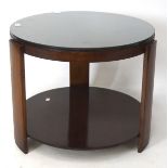 A vintage veneered coffee table, of circular form, with glass top,