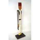 A novelty figure of a soldier dressed in the attire of the Egyptian army,
