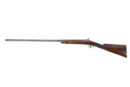 A 19th century percussion cap rifle with engraved game bird and scrolls to side, dark wood butt,