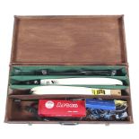 Two archery bows housed in a wooden storage case,