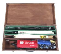 Two archery bows housed in a wooden storage case,