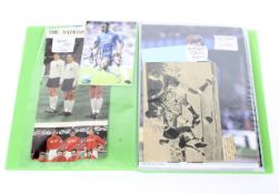 A folder of containing a collection of football autographs,