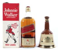 A large bottle of 1980 Johnnie Walker, and a Bells blended Scotch whisky ceramic decanter