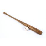 A vintage baseball bat and ball,