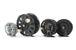An assortment of four fly fishing reels,