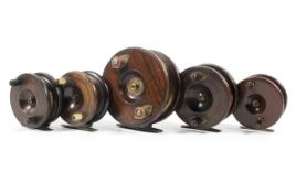A selection of five early 20th century wooden brass mounted fishing reels,