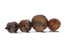 Four assorted early/mid 20th century mahogany and brass fly fishing reels,