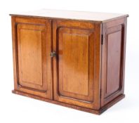 An Edwardian mahogany and oak small table top cabinet,