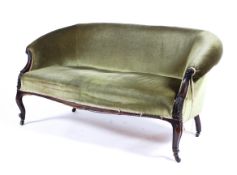 An Edwardian mahogany framed ladies boudoir sofa raised on carved cabriole and ball supports to