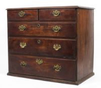 An early 19th century mahogany chest of two short over three long graduating drawers,