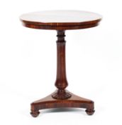 A Victorian mahogany circular occasional/wine table raised on a turned column to a flower rose