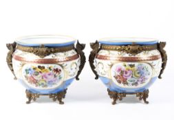 A pair of gilt-metal mounted Limoges porcelain jardinieres, 20th century, blue marks,