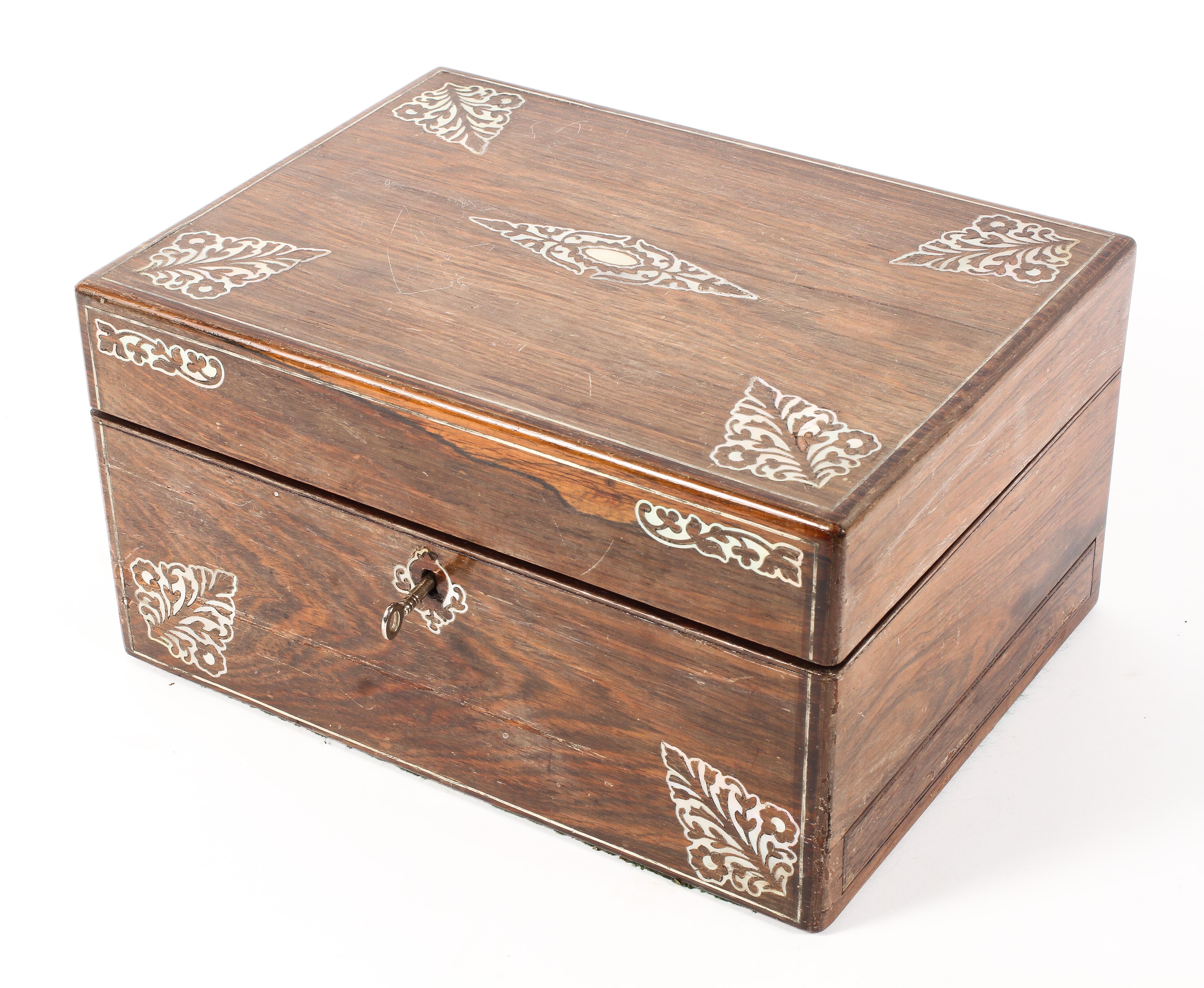 A 19th century rosewood and mother of pearl inlay ladies traveling vanity box with fitted red
