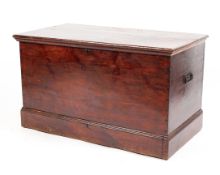 A 19th Centry stained pine chest with metal carrying handles,