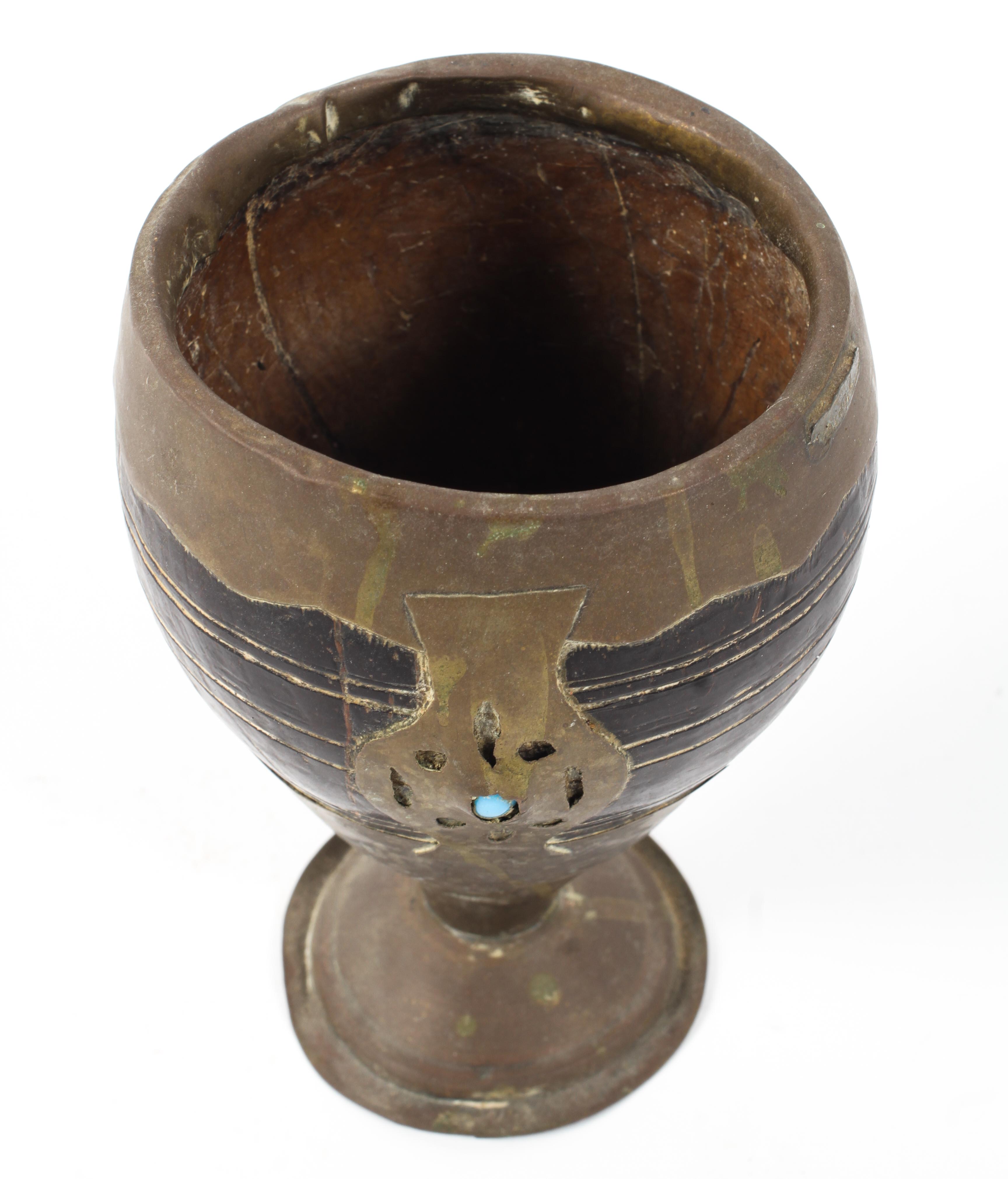 A Middle Eastern Coconut cup set within a brass holder and pedestal decorated with turquoise beads - Image 2 of 2