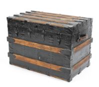 A 19th century wooden slatted and metal bound travelling trunk,
