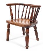 A 19th century child's ash and elm elbow chair with spindle back,