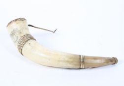 A 19th century skrimshaw decorated compounded cow horn, inscribed New York above a town,