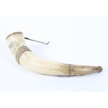 A 19th century skrimshaw decorated compounded cow horn, inscribed New York above a town,