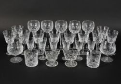 A collection of Waterford crystal drinking glasses, comprising: ten large wine glasses,