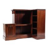 An Edwardian mahogany corner bookcase of three fixed shelves and three adjustable with attached