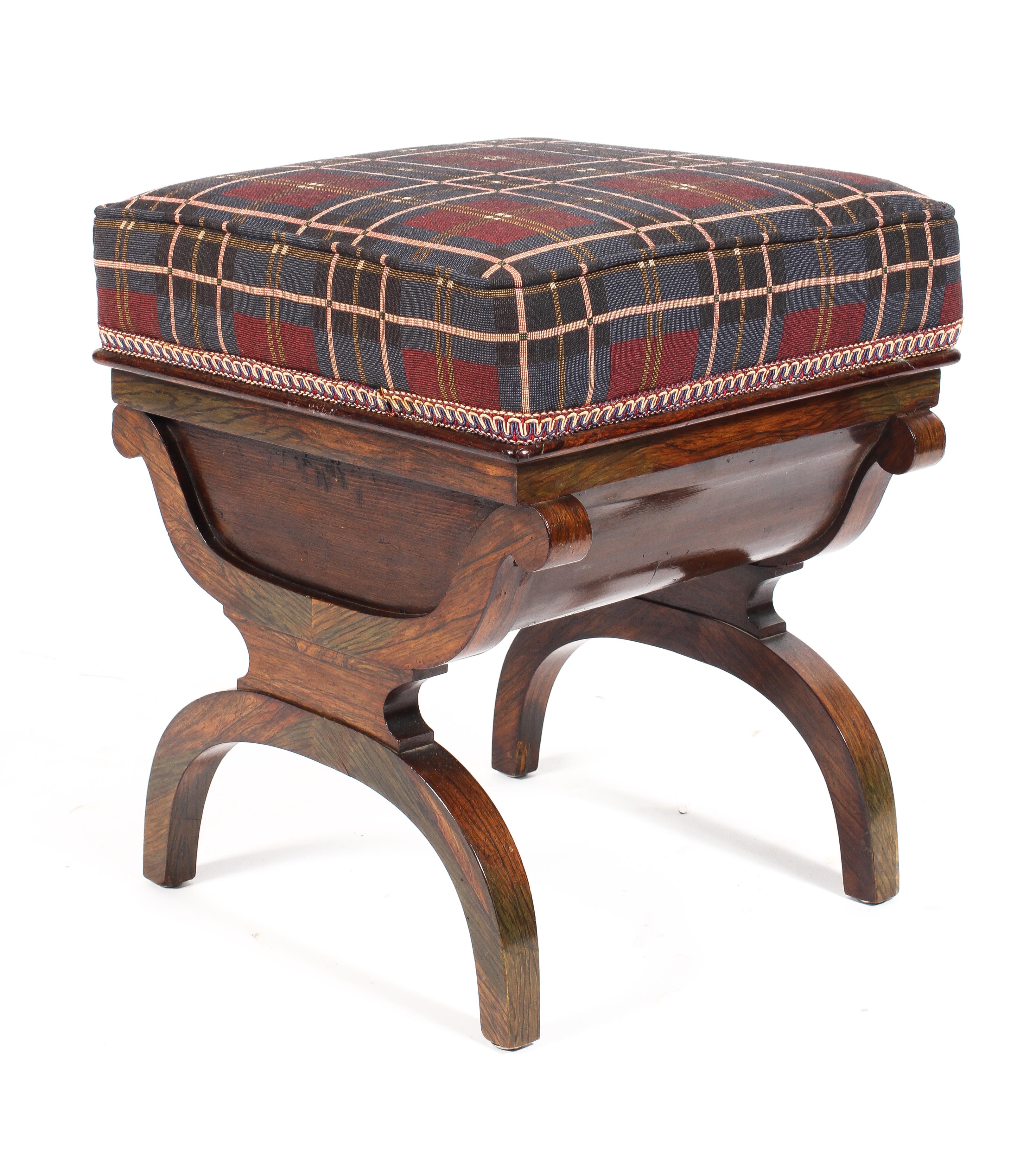 A 20th century stained stool with padded rising seat above a compartment raised on an arched X