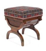 A 20th century stained stool with padded rising seat above a compartment raised on an arched X
