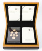 A 2008 Royal Shield of Arms gold proof collection with £1, 50p, 20p, 10p, 5p, 2p, 1p coins, 84.