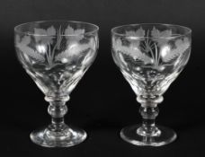 A pair of hand blown wheatsheaf and grape vine etched ale glasses,