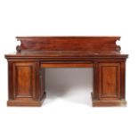 A Victorian mahogany pedestal sideboard with gallery back and central frieze drawer flanked by two