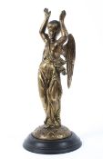 A 19th centry brass figure of an angel, with date lozenge to the back, mounted on an ebonised base,