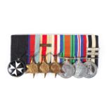 A group of seven medals including Order of St John, 1939-1945 Star, African Star and bar,