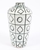 A mid-century vintage tapering ceramic vase in a white and black geometric design, probably Italian,