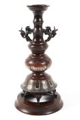 A late 19th/early 20th Chinese bronze and champleve lamp base decorated with a band of lotus leaves