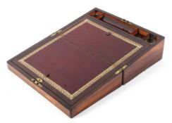 A Victorian rosewood writing slope with mother of pearl inlay to to the lid with tooled leather