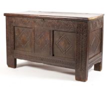 A late 18th early 19th century oak coffer with later lid with all over carved decoration with