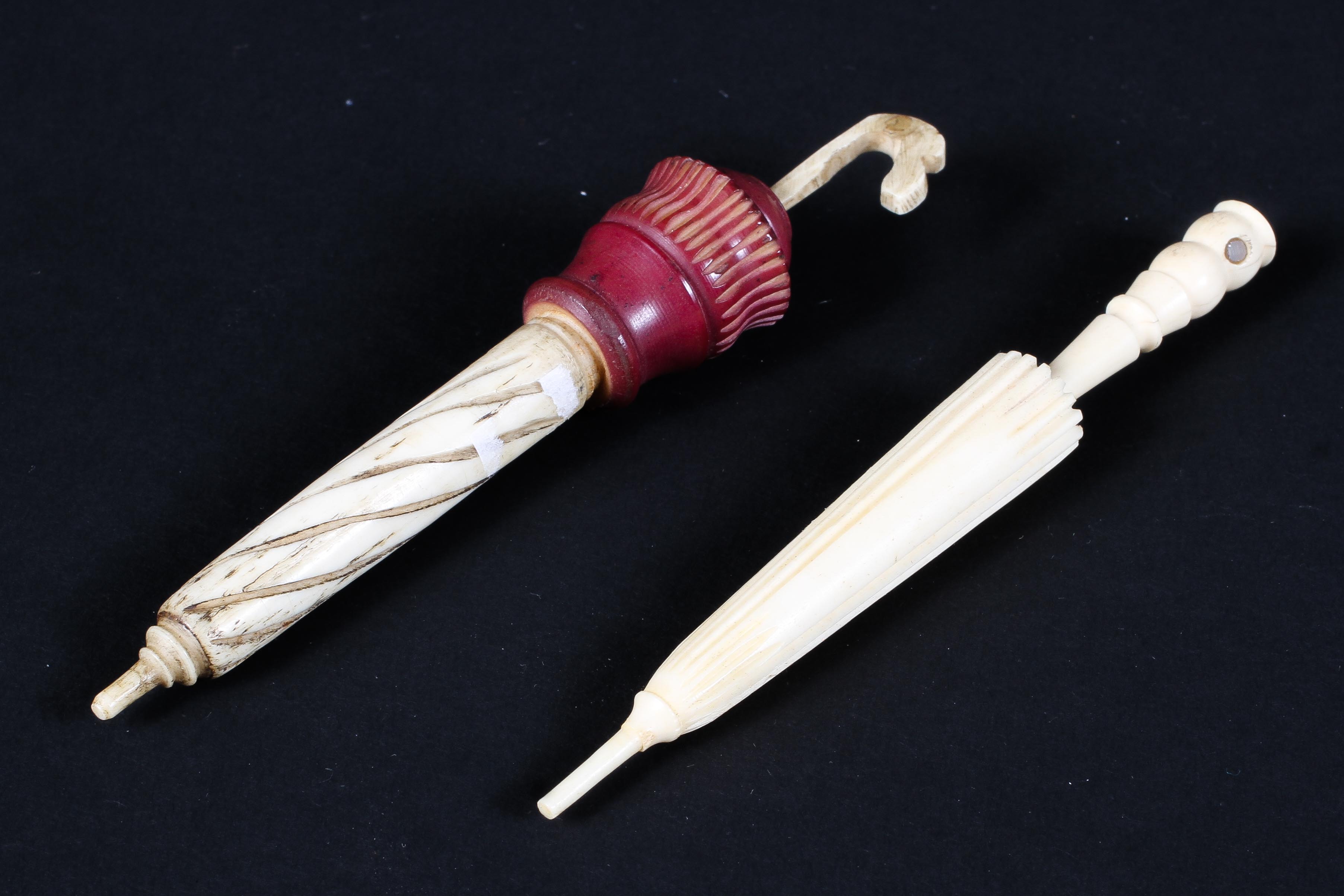 Two 19th century ivory needle holders both in the form of collapsed umbrellas, 11.